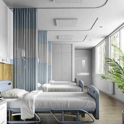 Ein moderner Krankenhausraum mit zwei leeren Betten, blauen Vorhängen und großen Fenstern. Helle Wände und Holzboden schaffen eine beruhigende Atmosphäre.
