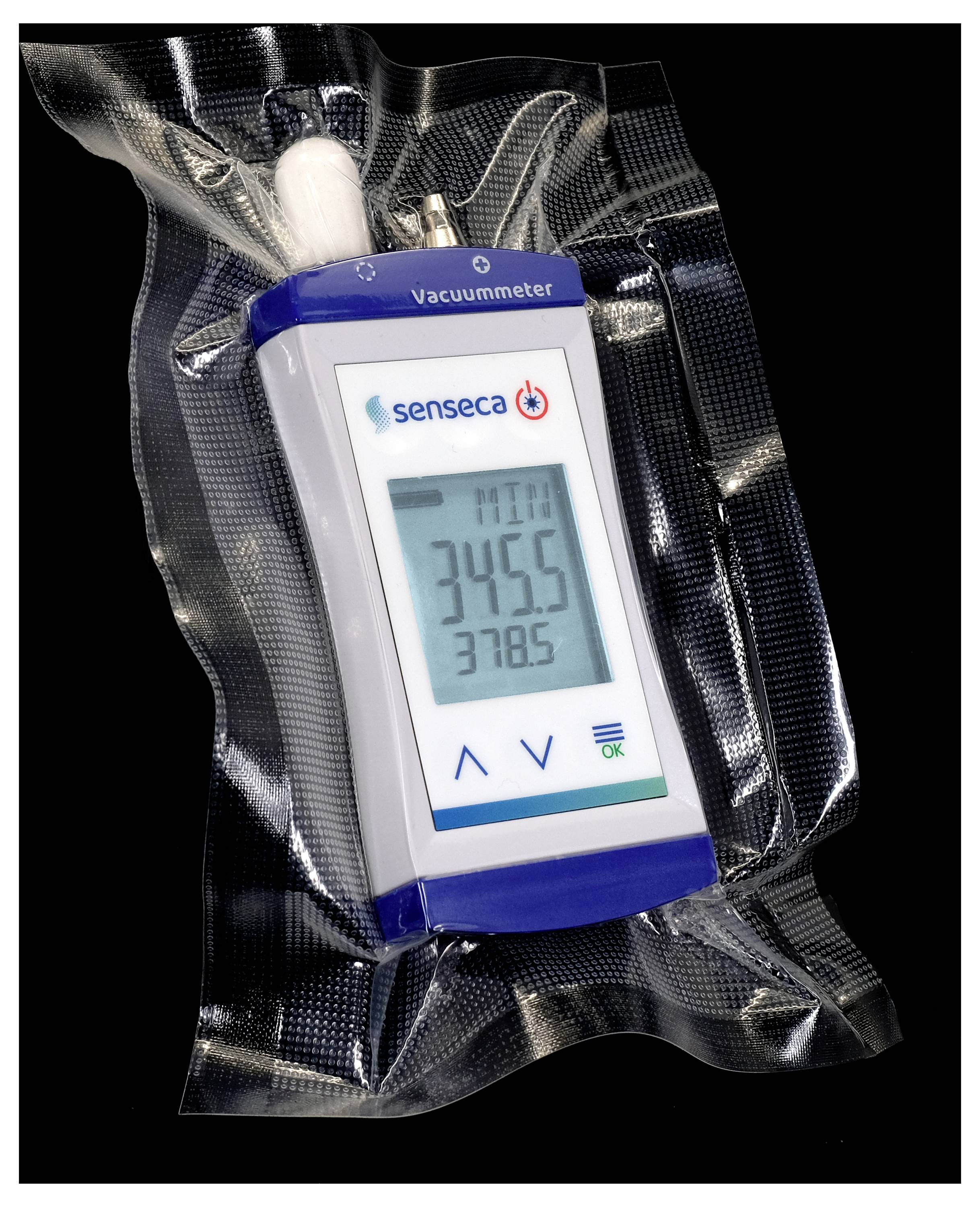 Ein Verpackungs-Vakuummeter zeigt auf einem Display die Werte '345.5' und '378.5'.