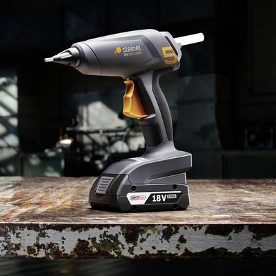 Akku-Heißklebepistole auf einem Tisch, Modell 'Steinel NEO3'. Robust, kabellos, geeignet für vielfältige Klebeanwendungen.