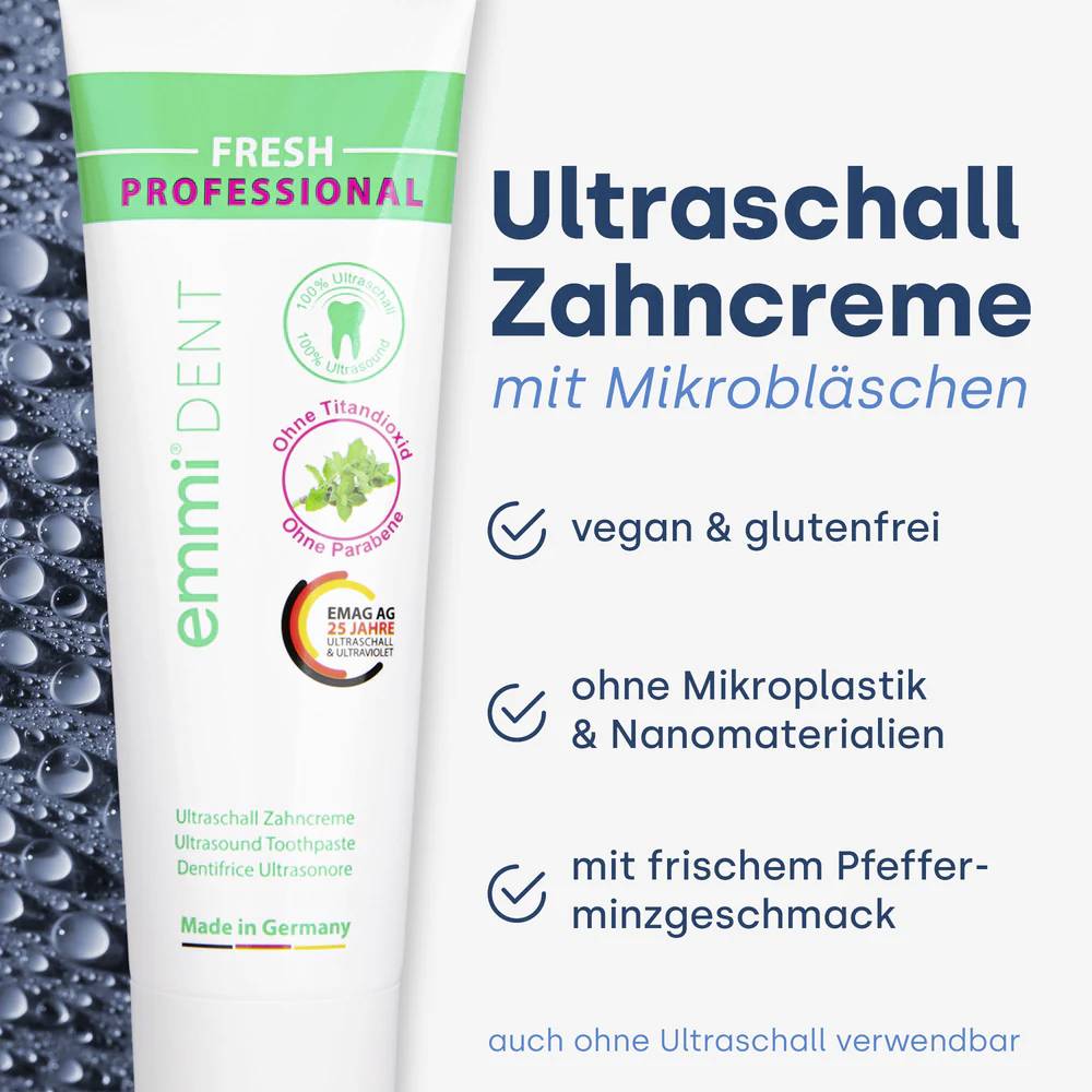 Zahnpastatube. Text: 'Ultraschall Zahncreme mit Mikrobläschen', vegan, glutenfrei, ohne Mikroplastik, frischer Pfefferminzgeschmack.