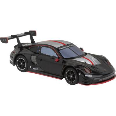 Schwarzes Spielzeugauto mit roten Akzenten und großem Heckspoiler, inspiriert von einem Rennwagen-Design.