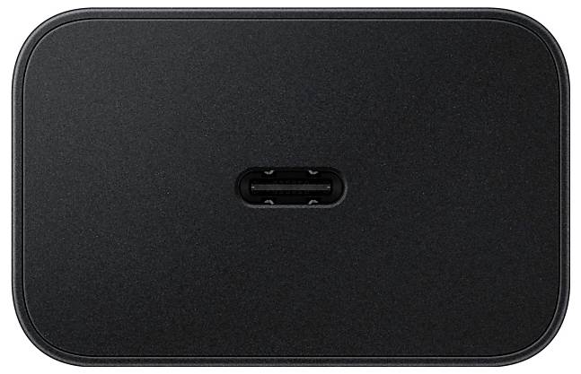 Ein schwarzes, ovales Gerät mit einem USB-C-Anschluss in der Mitte, von oben betrachtet. Die Oberfläche ist glatt und matt und deutet auf eine Ladestation hin.