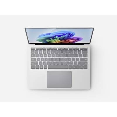 Ein silberner Laptop mit einem bunten abstrakten Design auf dem Bildschirm, von oben betrachtet, mit vollständiger Tastatur und Trackpad.