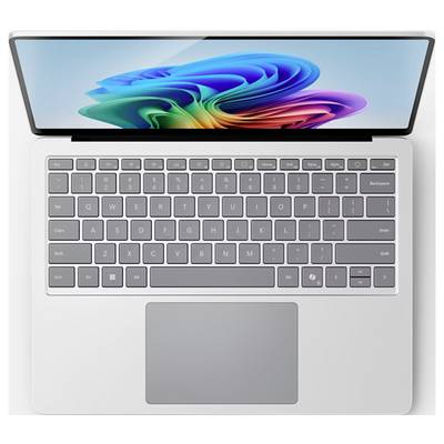 Ein silberner Laptop mit einem bunten abstrakten Design auf dem Bildschirm, von oben betrachtet, mit vollständiger Tastatur und Touchpad.