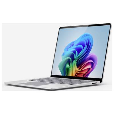 Ein schlankes Laptop mit bunter, abstrakter Digitalkunst auf dem Bildschirm vor einem schlichten grauen Hintergrund.