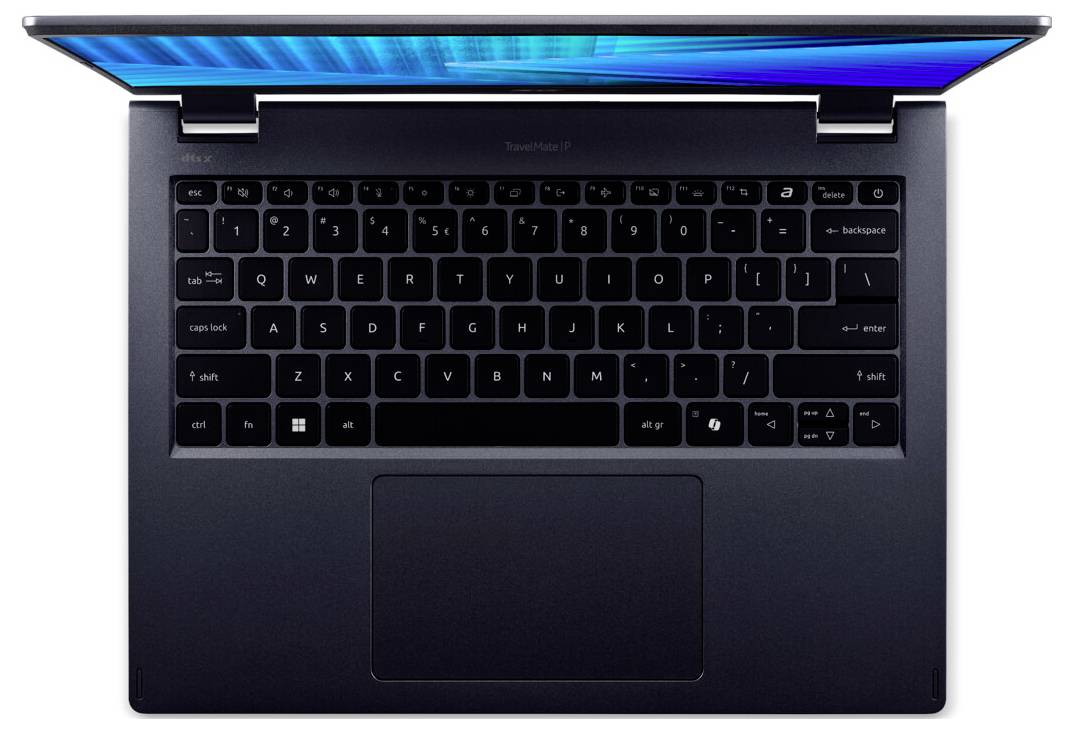 Ein offener silberner Laptop aus Draufsicht, der die Tastatur und einen Teil des Bildschirms mit einem blauen Farbverlauf zeigt.