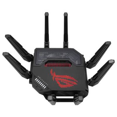 Ein schwarz-roter Router mit acht Antennen, die aussehen wie Spinnenbeine. Lässt auf hohe Netzwerkleistung und Reichweite schließen.
