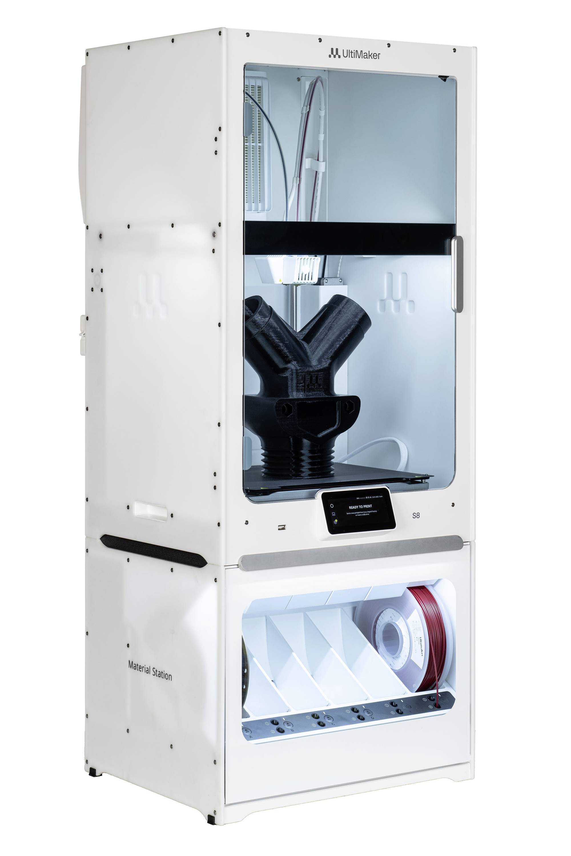 3D-Drucker in einem weißen Gehäuse mit durchsichtigem Fenster. Zwei schwarze Düsen im Inneren sichtbar. Unten ist ein Materiallager.