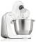 Eine weiße Küchenmaschine mit Metallrührschüssel und Schneebesenaufsatz; geeignet zum Mixen und Kneten verschiedener Zutaten.