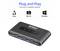 Ein schwarzer USB-Hub mit vier USB-3.0-Anschlüssen. Text darüber liest sich "Plug and Play", kompatibel mit Linux, Mac OS und Windows.