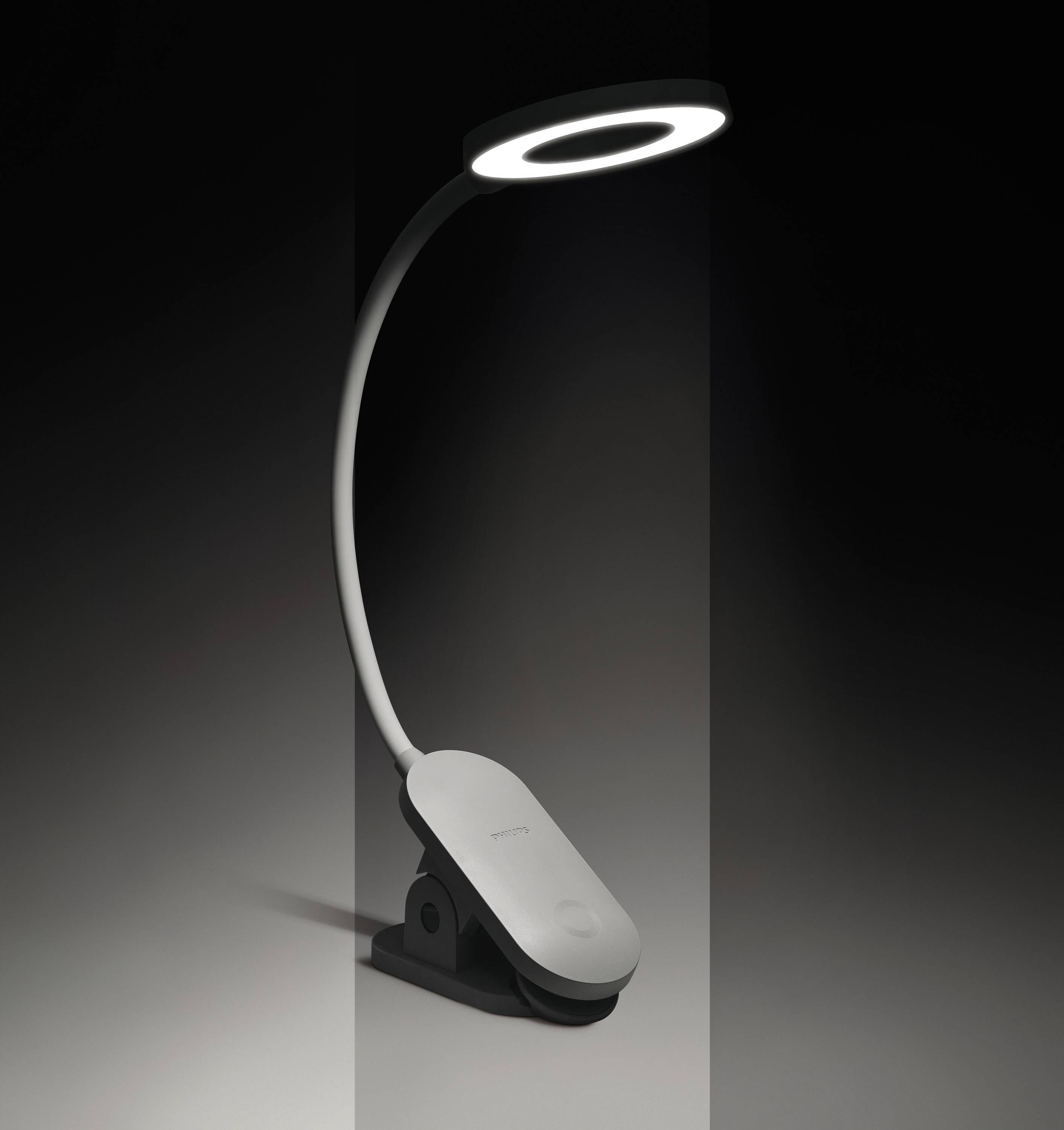 Flexible LED-Schreibtischlampe mit kreisförmigem Leuchtkopf, auf schwarzem Hintergrund. Modernes, minimalistisches Design.