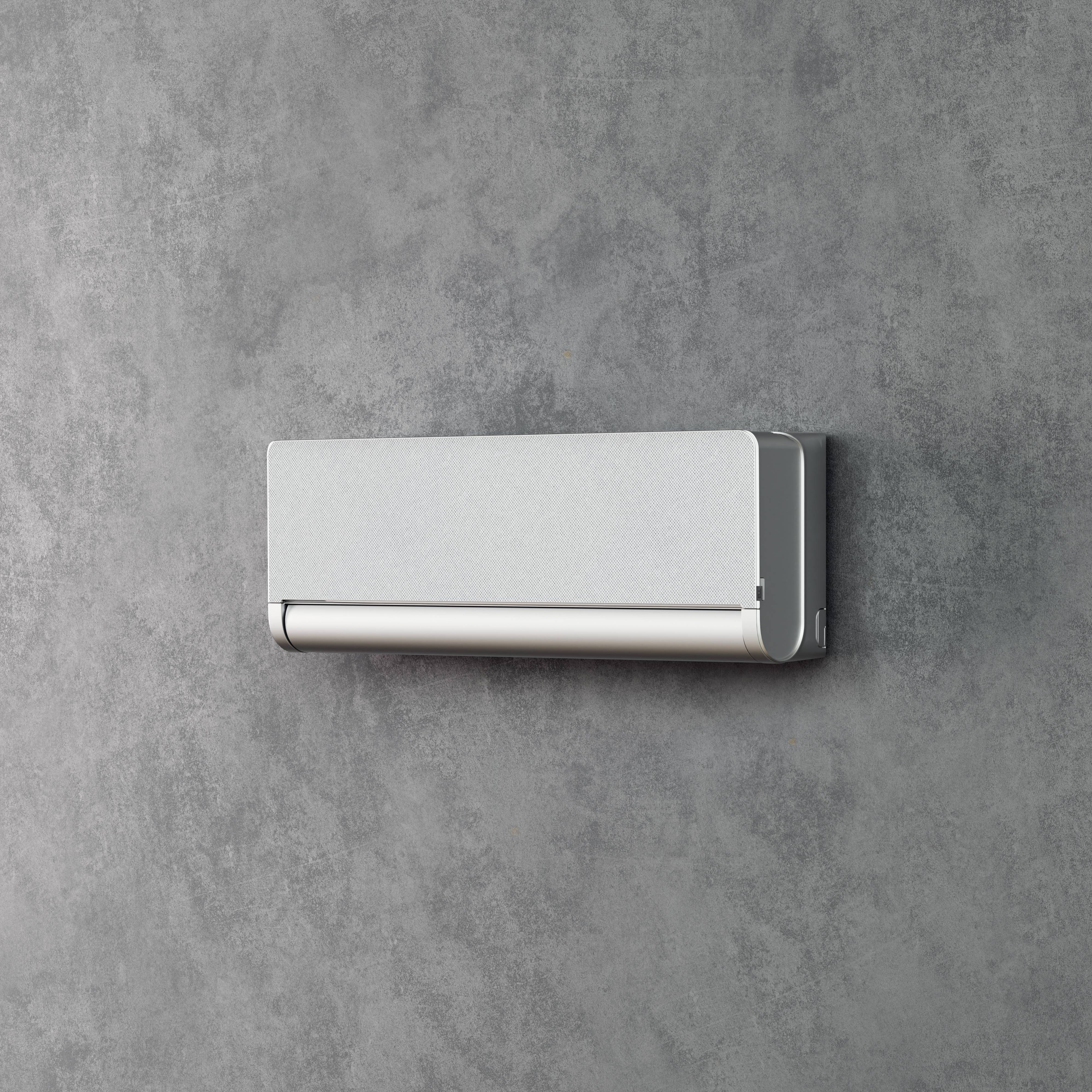 Eine moderne Klimaanlage ist an einer grauen Wand montiert.