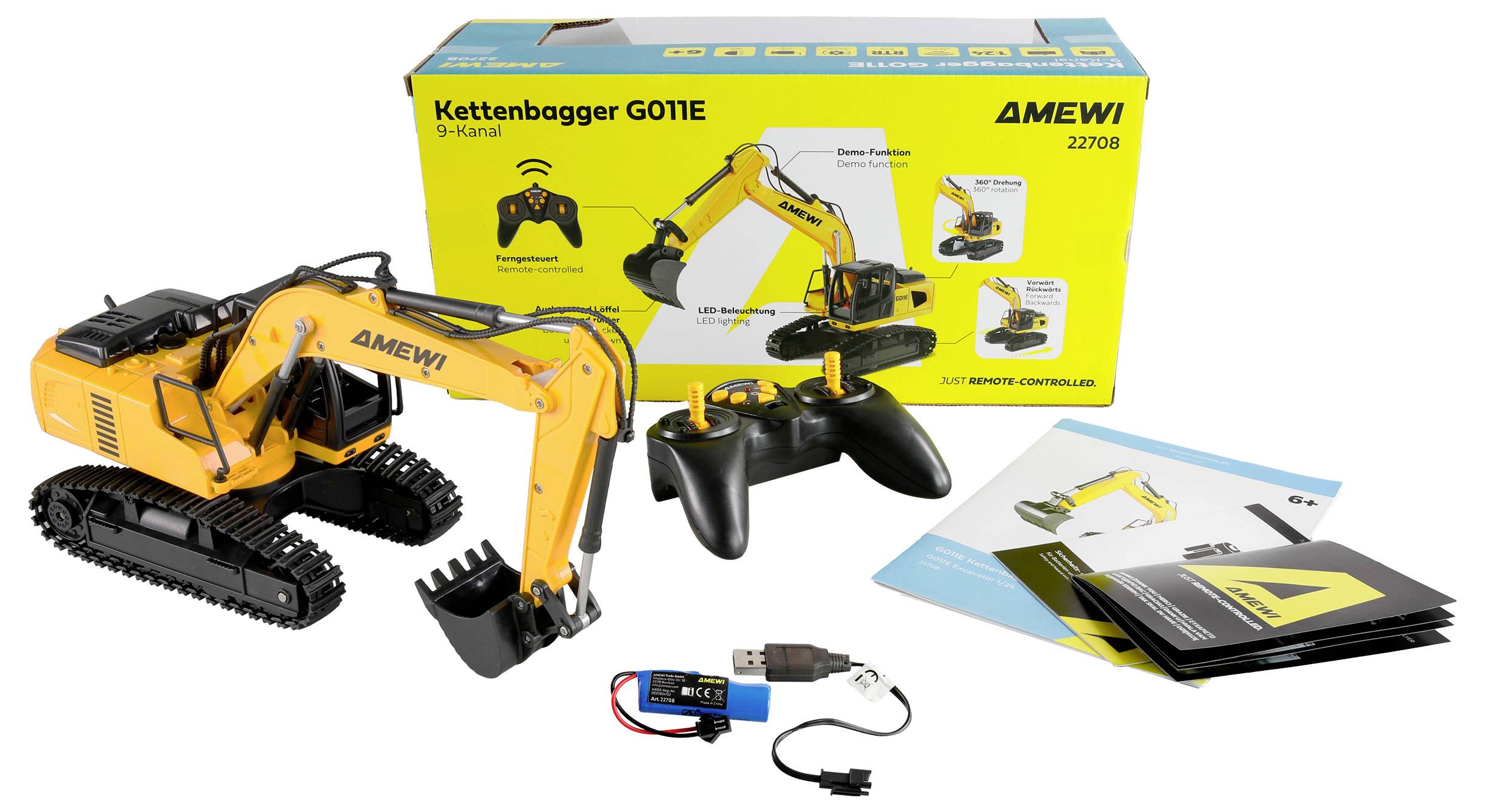 Ein ferngesteuerter gelber Kettenbagger mit Controller. Verpackung im Hintergrund zeigt den Bagger und Anleitungen liegen daneben.
