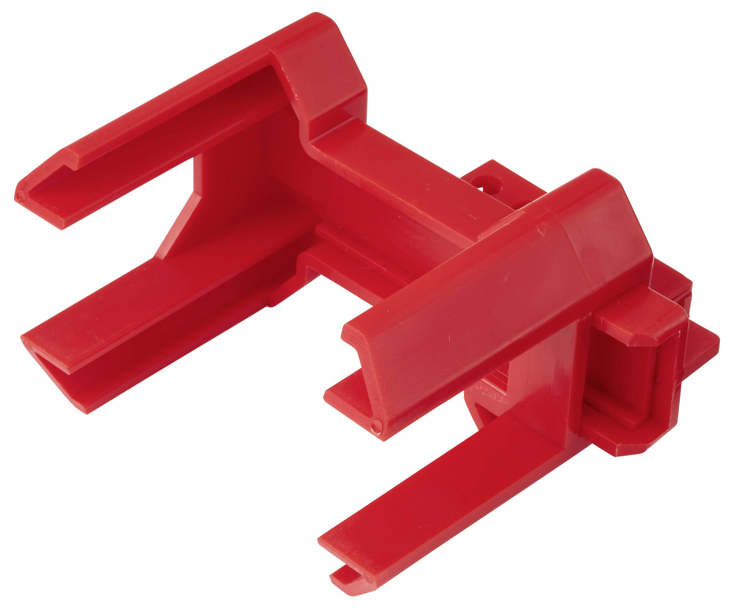 Ein rotes Plastikgerät mit offenen rechteckigen Schlitzen und einer zentralen Stütze, möglicherweise zum Halten oder Organisieren von Gegenständen.