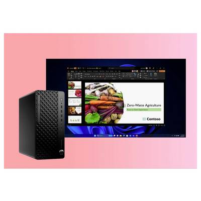 Ein Computermonitor zeigt eine Präsentation mit dem Titel Zero-Waste Agriculture, während ein Desktop-PC links daneben vor einem rosa Hintergrund steht.