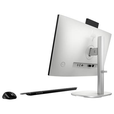 Ein modernes Desktop-Computer-Setup, von hinten betrachtet, mit Anschlüssen; inklusive einer drahtlosen Maus und Tastatur.
