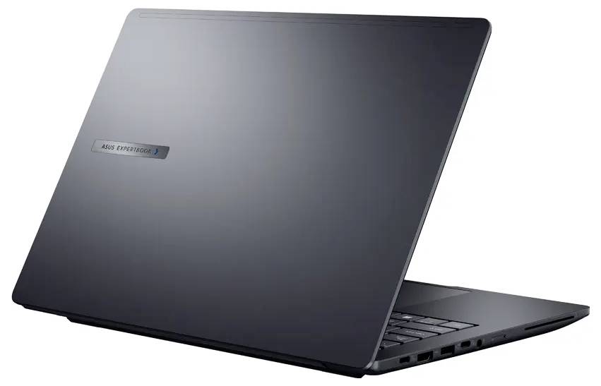 Das Bild zeigt einen schlanken, dunkelgrauen Laptop, der teilweise geöffnet ist und auf der Oberseite ein Logo trägt. Der Laptop wird von der Rückseite aus betrachtet.