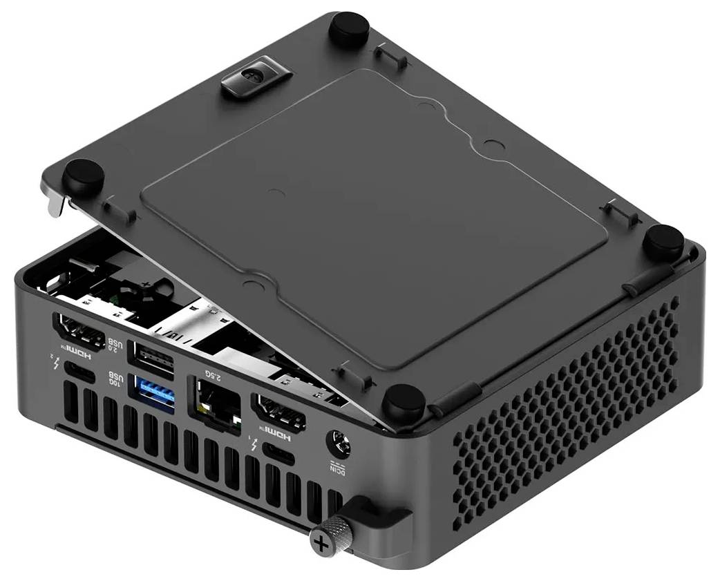 Kleiner schwarzer Computergehäuse mit offener Abdeckung, die HDMI-, USB- und Ethernet-Anschlüsse zeigt. Schwarze Schrauben an den Ecken, Lüftungslöcher an der Seite.