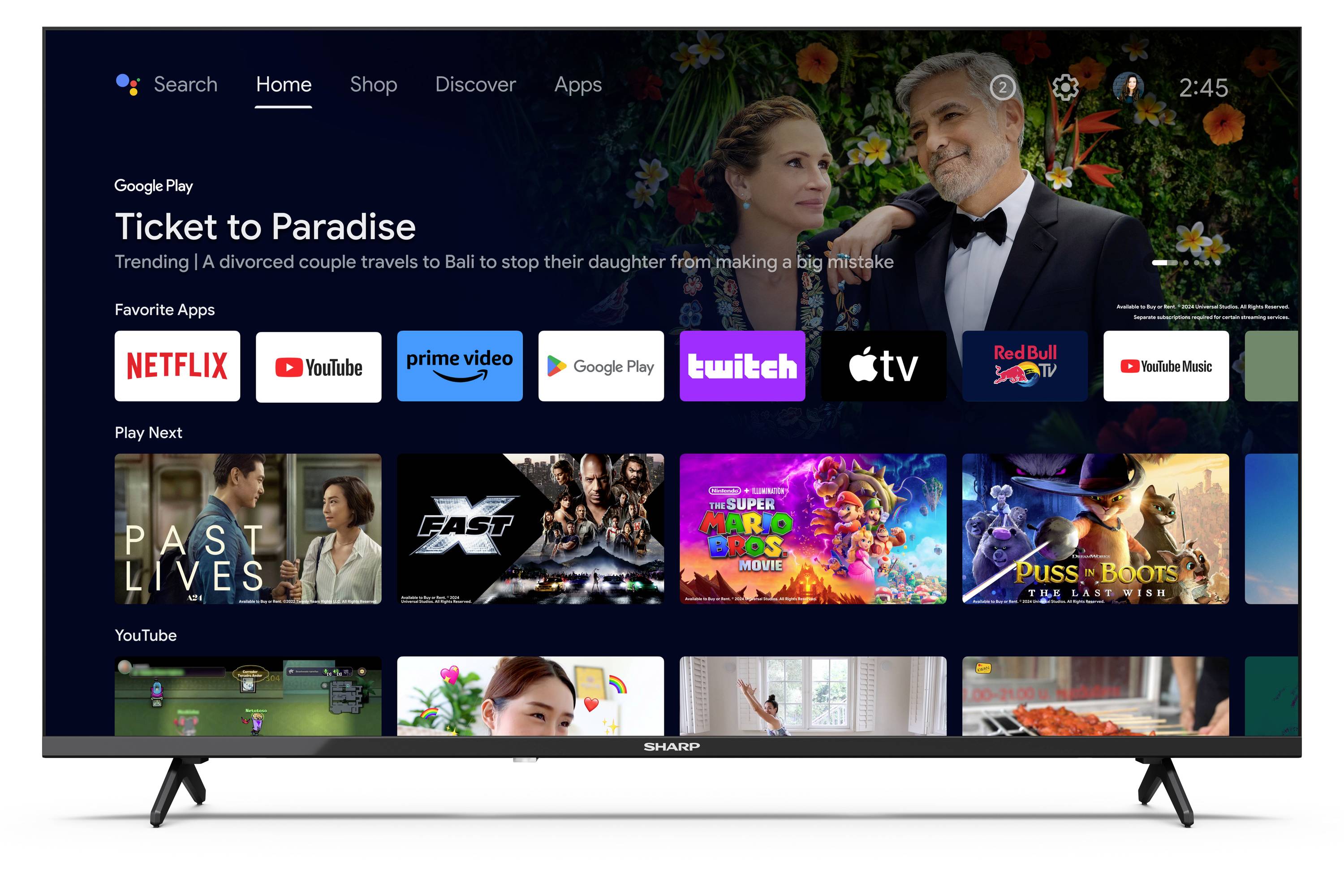 Eine Smart-TV-Oberfläche, die einen Filmauswahlbildschirm mit dem Film ‚Ticket to Paradise' zeigt. Apps wie Netflix, Prime Video und YouTube sind ebenfalls zu sehen.