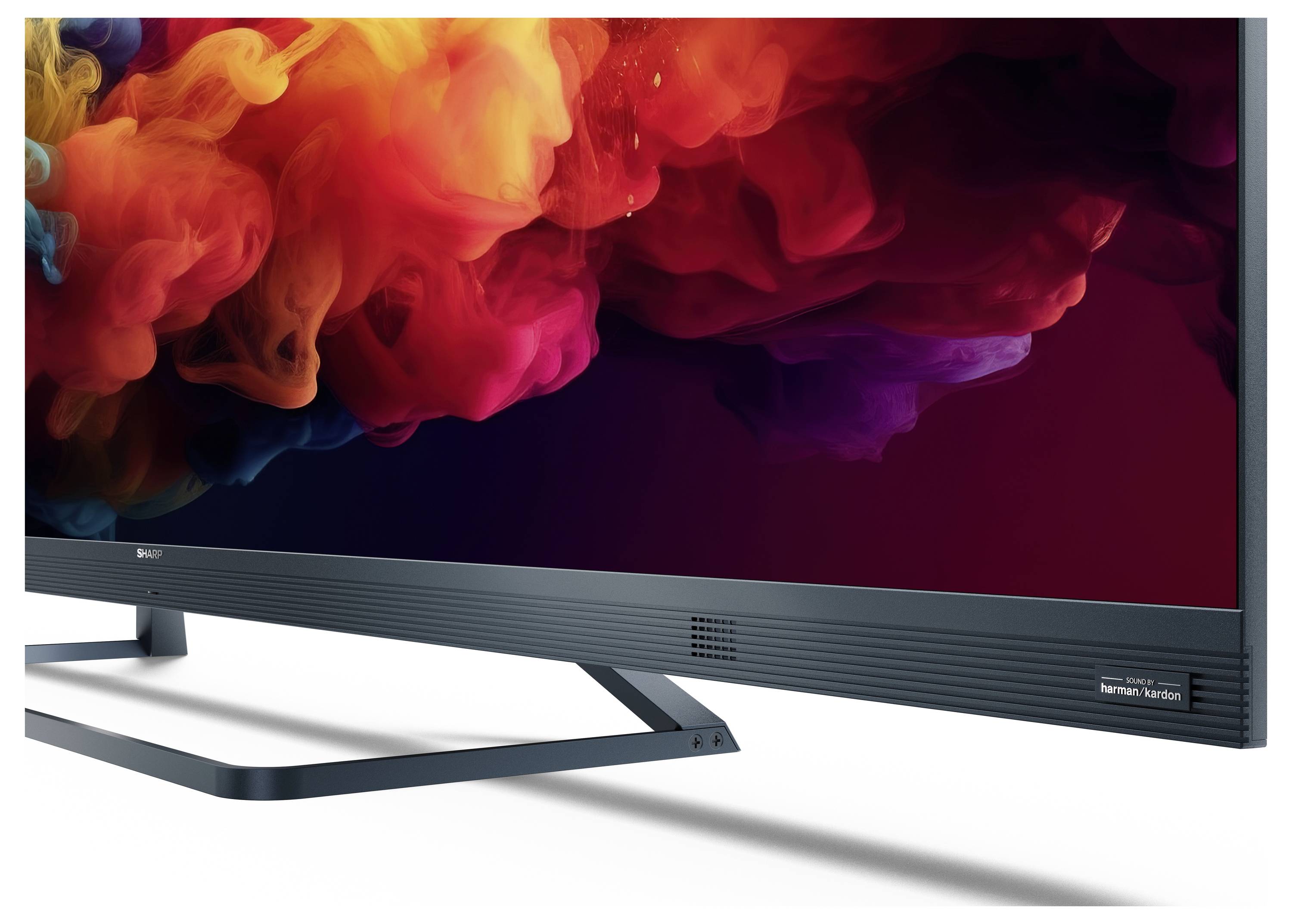 Ein schlanker, moderner Flachbildschirm-Fernseher mit lebhaften, farbenfrohen Wirbelmustern auf dem Bildschirm, vor einem weißen Hintergrund.
