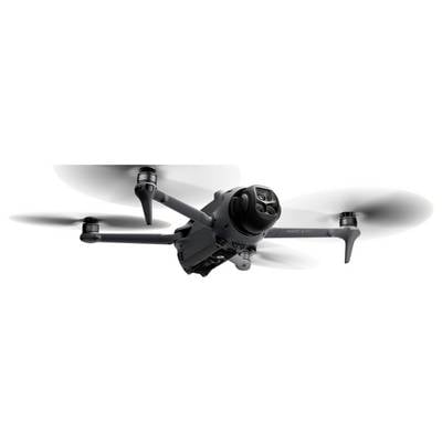 Eine Quadcopter-Drohne, die in der Luft schwebt, mit vier rotierenden Propellern und einer Kamera in der Mitte. Die Drohne wirkt schlank und modern.