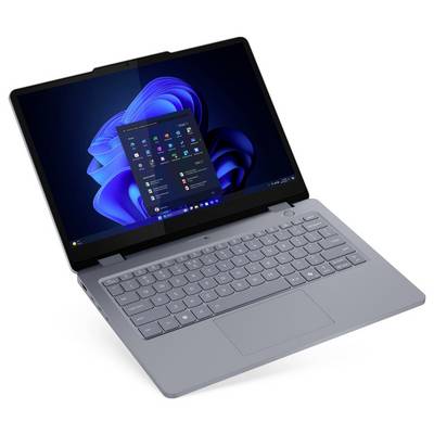 Ein Laptop mit einer grauen Tastatur zeigt den Windows 11 Startbildschirm.