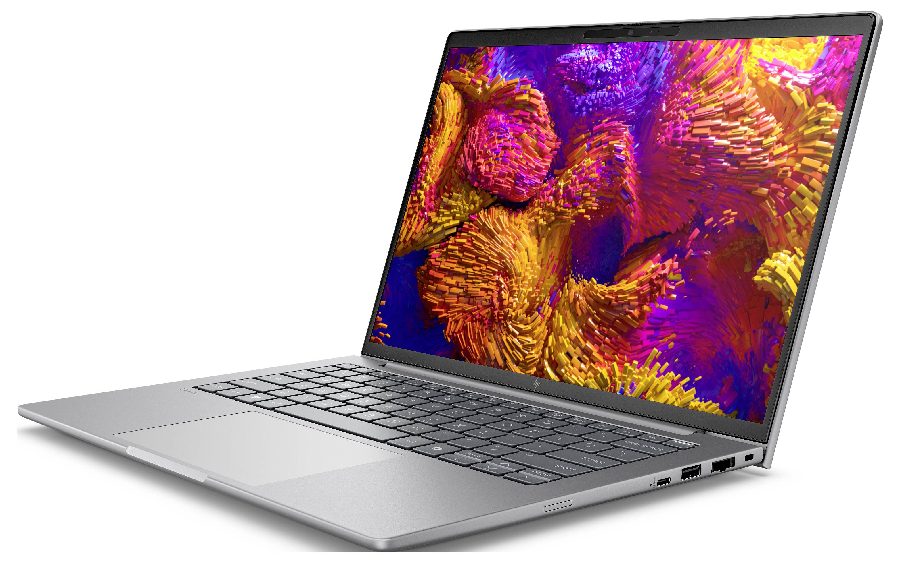 Ein silberner Laptop, der eine lebendige, abstrakte Kunst auf dem Bildschirm zeigt, mit roten, orangefarbenen und violetten Texturen.