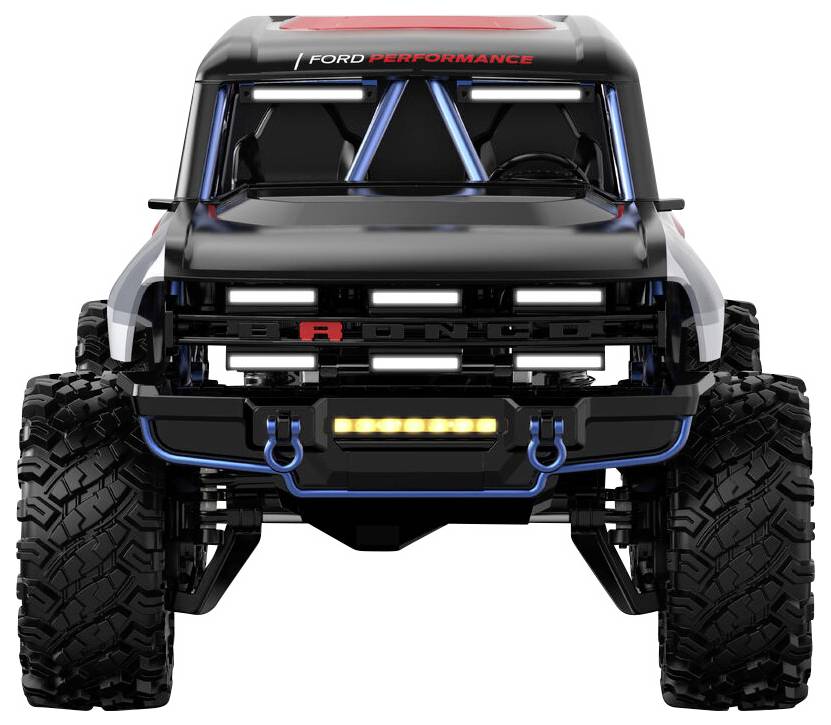 Ein schwarzes Geländefahrzeug mit großen Reifen und 'Ford Performance' Branding, von vorne betrachtet, mit Betonung auf robustem Design und Haltbarkeit.