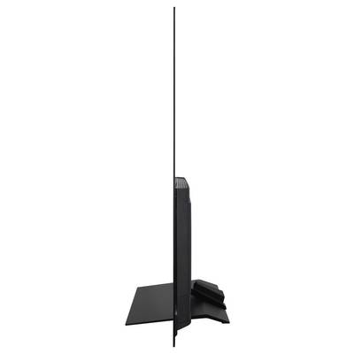 Seitenansicht eines ultraflachen, schmalen Fernsehers auf einem Ständer, der seine minimale Tiefe betont.