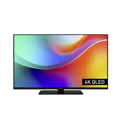 Ein Flachbildschirm-Fernseher, der ein lebendiges, mehrfarbiges Design zeigt, mit der Aufschrift '4K QLED' in der Ecke, was auf die Display-Technologie hinweist.