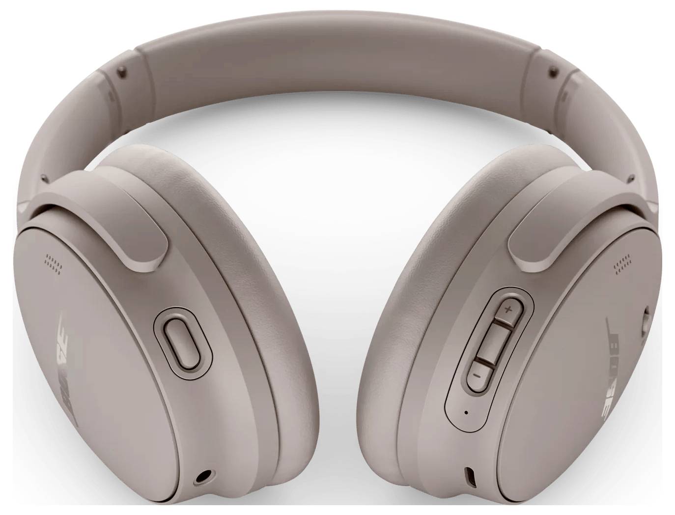 Noise-Cancelling Over-Ear-Kopfhörer in einer hellen Beige-Farbe, mit schlankem Design, verstellbarem Kopfbügel und Bedienungstasten an der Seite.