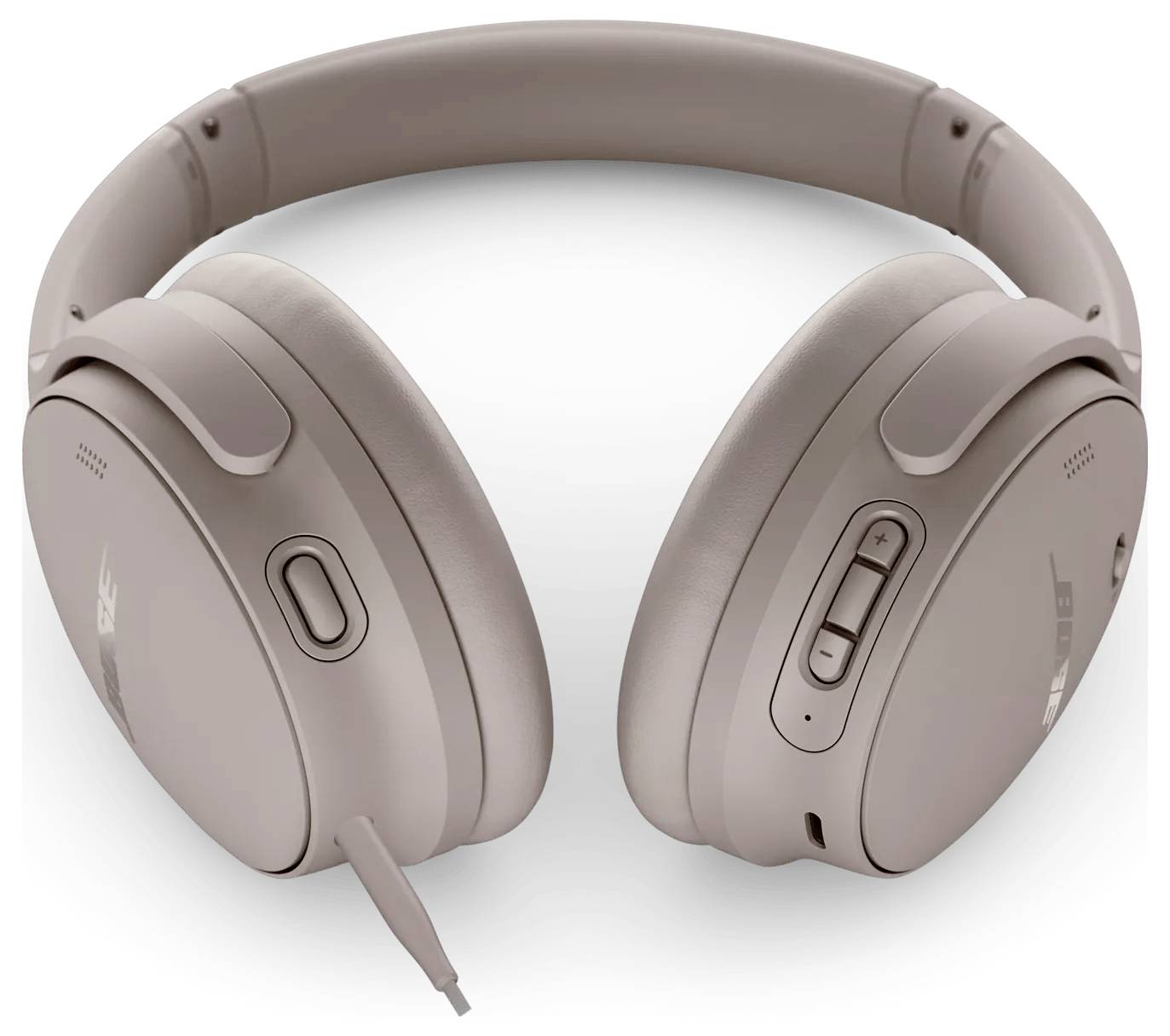 Kabellose Over-Ear-Kopfhörer in einer hellen Tanfarbe, mit einem eleganten Design und Tasten zur Lautstärke- und Wiedergabesteuerung auf der Ohrmuschel.