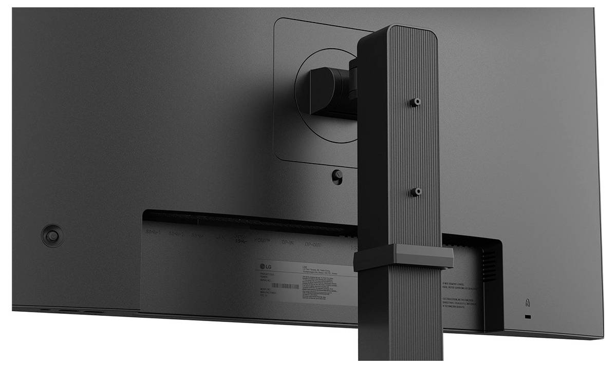 Rückansicht eines dunkel gefärbten Computermonitors auf einem Ständer, die Halterung und Anschlüsse zeigend.