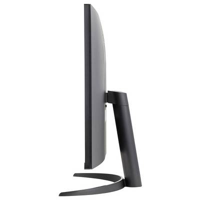 Seitenansicht eines schlanken, modernen Computermonitors mit geschwungener Form und einem eleganten, minimalistischen Ständer.
