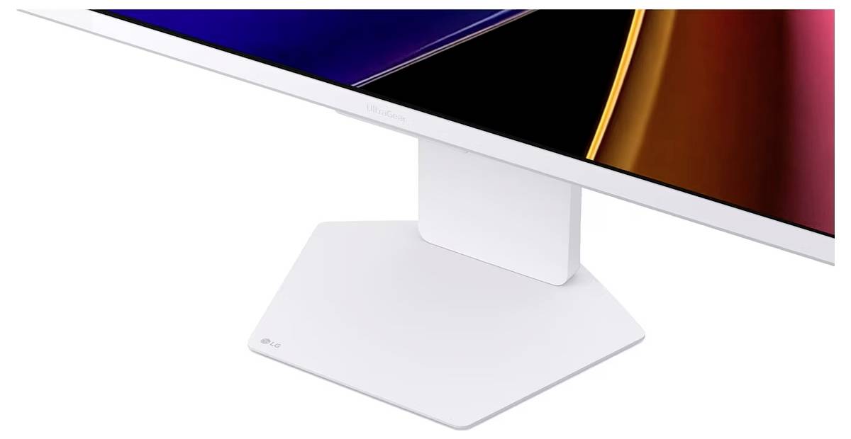 Ein moderner, weißer Computermonitor mit einer eleganten Basis und dünnem Rahmen, der ein farbenfrohes abstraktes Design zeigt.