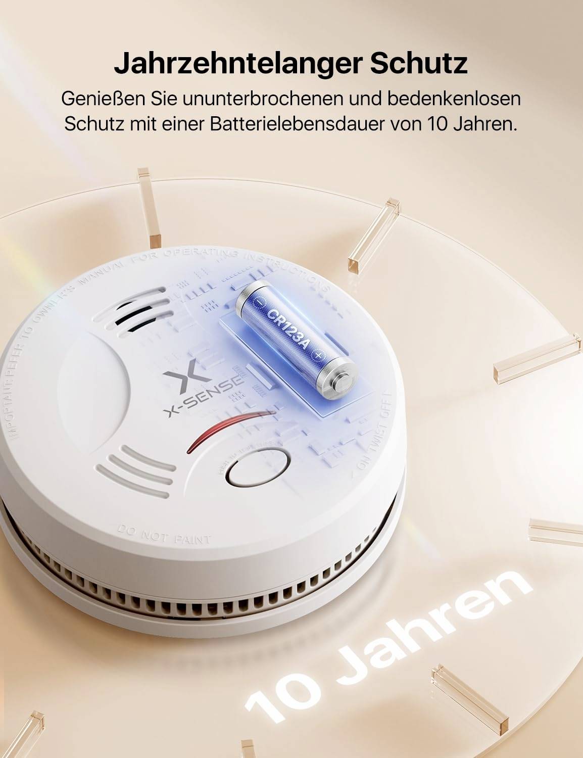 Rauchmelder mit Batterie, Aufschrift 'Dekadenschutz'. Text: 'Genießen Sie ununterbrochenen Schutz mit 10 Jahren Batteriedauer'.