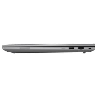 Geschlossener grauer Laptop, von der Seite betrachtet, mit verschiedenen Anschlüssen wie USB und Ethernet.