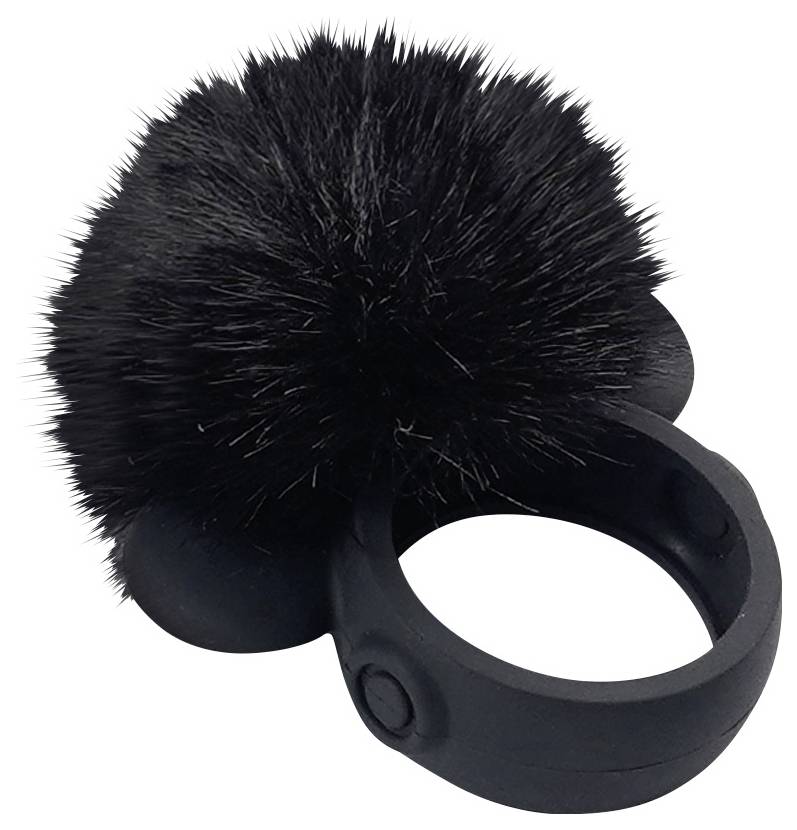 Ein schwarzer Ring mit einem flauschigen schwarzen Bommel, der wie ein kleines dekoratives Accessoire aussieht.