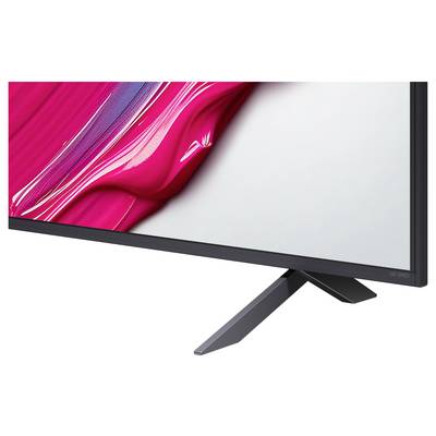 Ein schlanker, moderner Monitor, der abstrakte Kunst in leuchtendem Pink und Weiß auf dem Bildschirm zeigt. Der Monitor verfügt über einen schmalen schwarzen Rahmen und steht auf einem minimalistischen, abgewinkelten Ständer.
