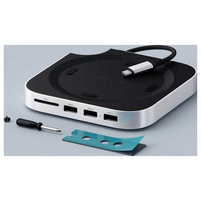 Ein schlanker USB-C-Hub mit mehreren Anschlüssen für HDMI und USB-Verbindungen, begleitet von einem Schraubendreher und einem petrolblauen Streifen auf einer grauen Oberfläche.