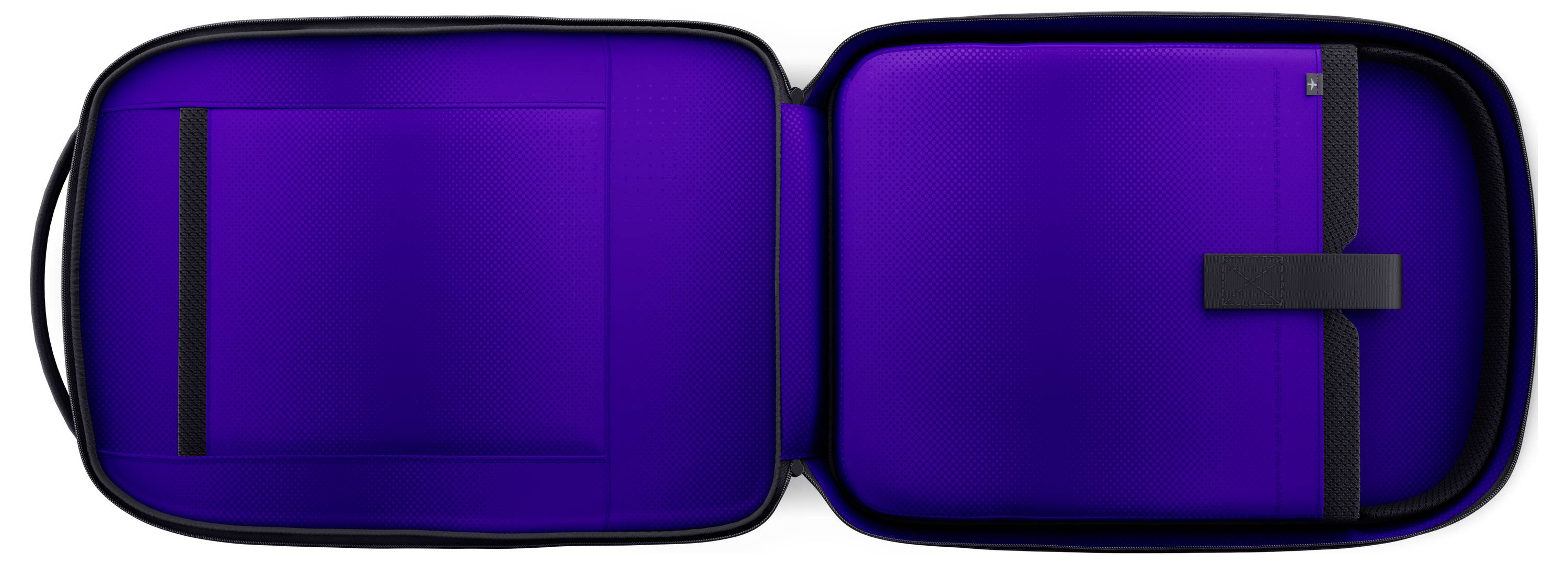Ein robuster Hartschalenkoffer geöffnet, der ein leuchtendes Violett im Inneren zeigt, mit Fächern zur Organisation von elektronischen Geräten und Zubehör.