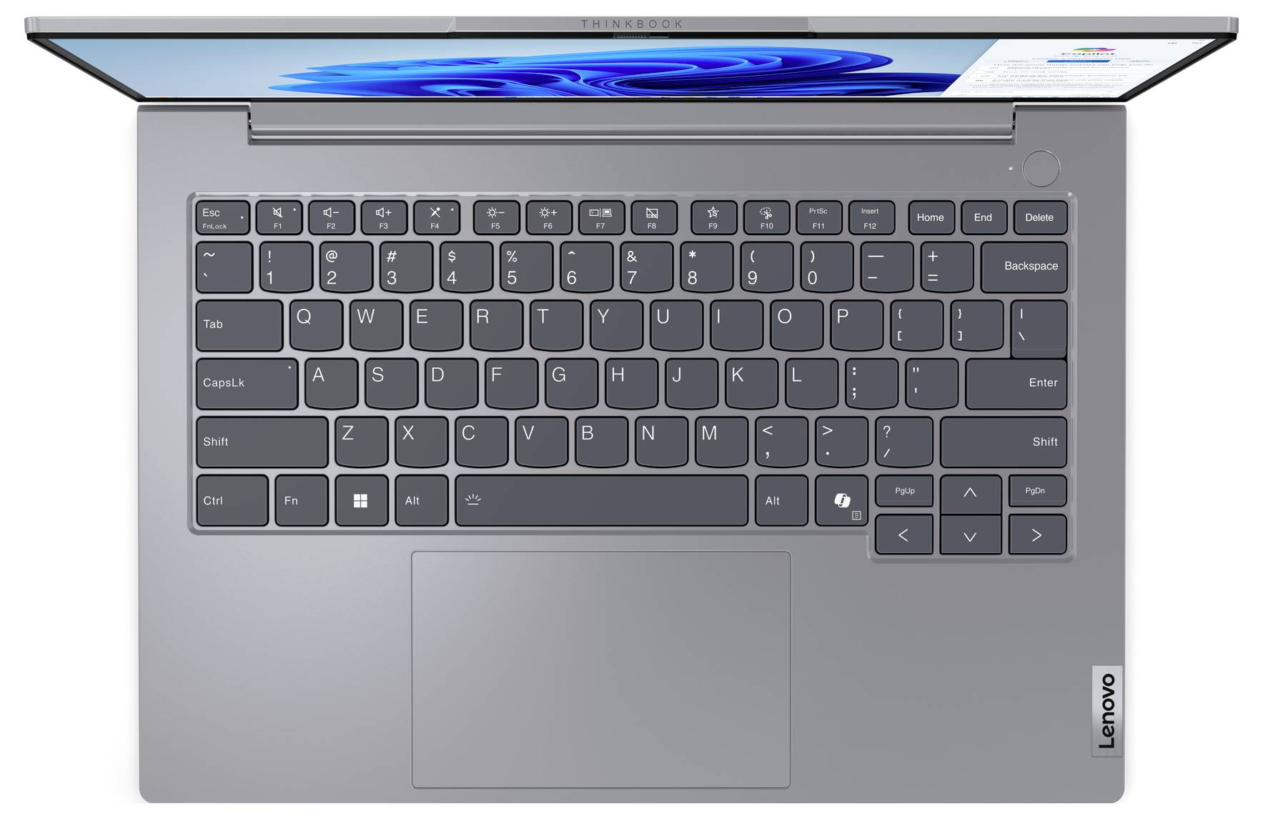 Draufsicht eines grauen Lenovo-Laptops mit Tastatur, Touchpad und Windows-Benutzeroberfläche auf dem Bildschirm.