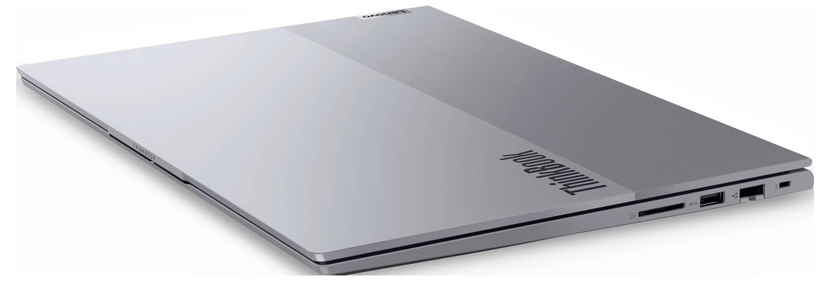 Ein schlankes, geschlossenes Laptop mit metallfarbener Oberfläche, ausgestattet mit zwei USB-Anschlüssen und einem Kopfhöreranschluss an der Seite.