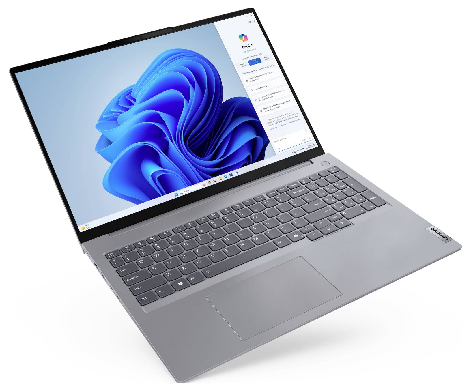Ein schlankes silbernes Laptop mit einem sichtbaren Bildschirm, der ein blaues abstraktes Design und ein geöffnetes Einstellungsfenster zeigt, ausgestattet mit einer vollständigen Tastatur.