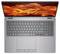 Ein Laptop mit einer silbernen Tastatur und einem lebhaften, wirbelnden orangefarbenen Muster auf dem Bildschirm, von oben betrachtet.