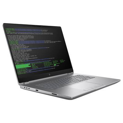 Ein silberner Laptop, der ein Terminalfenster mit Codezeilen in weißem, blauem und grünem Text auf schwarzem Hintergrund anzeigt.