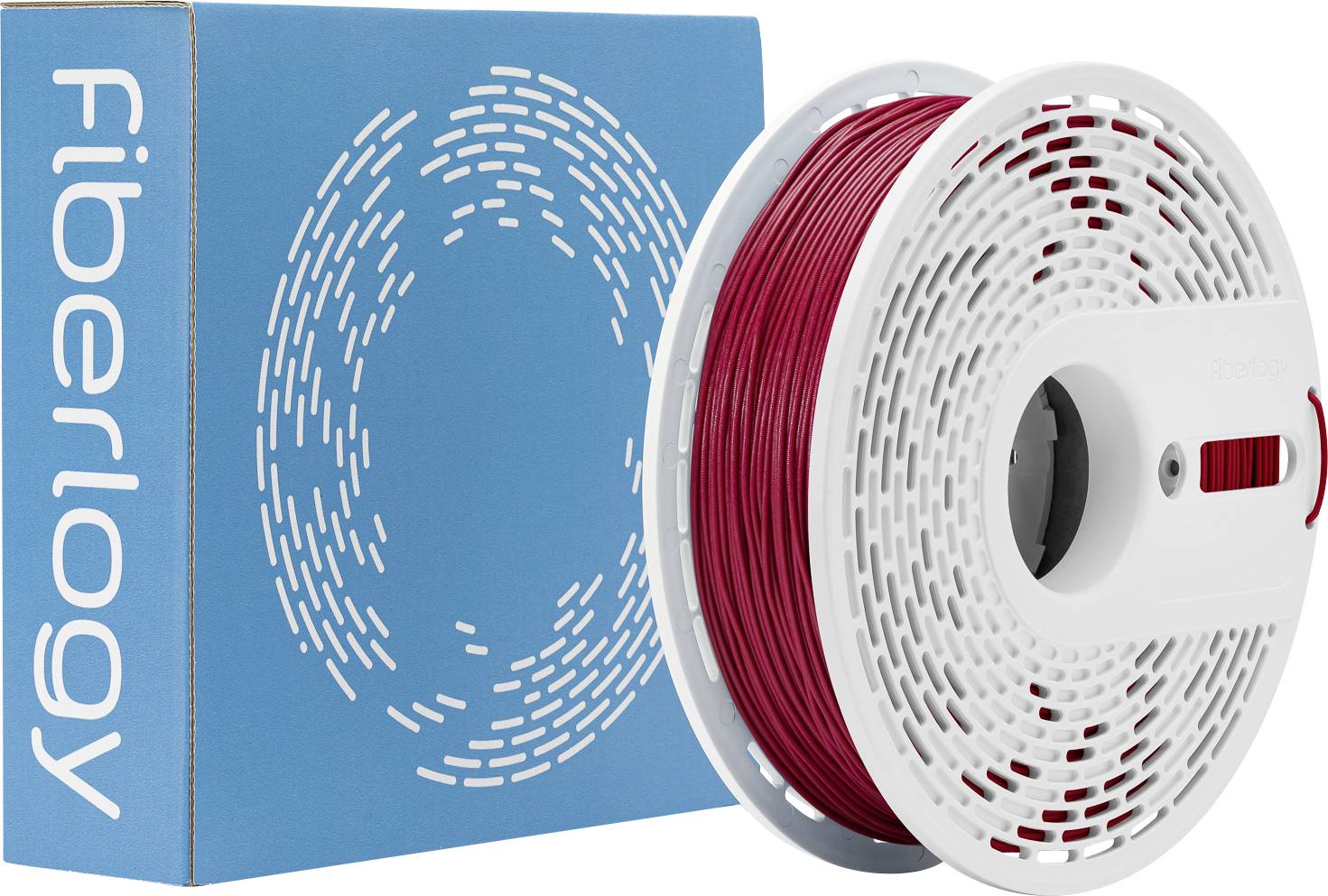 Rote 3D-Druckerfilamentspule neben einer blauen Box mit der Aufschrift "Fiberlogy".
