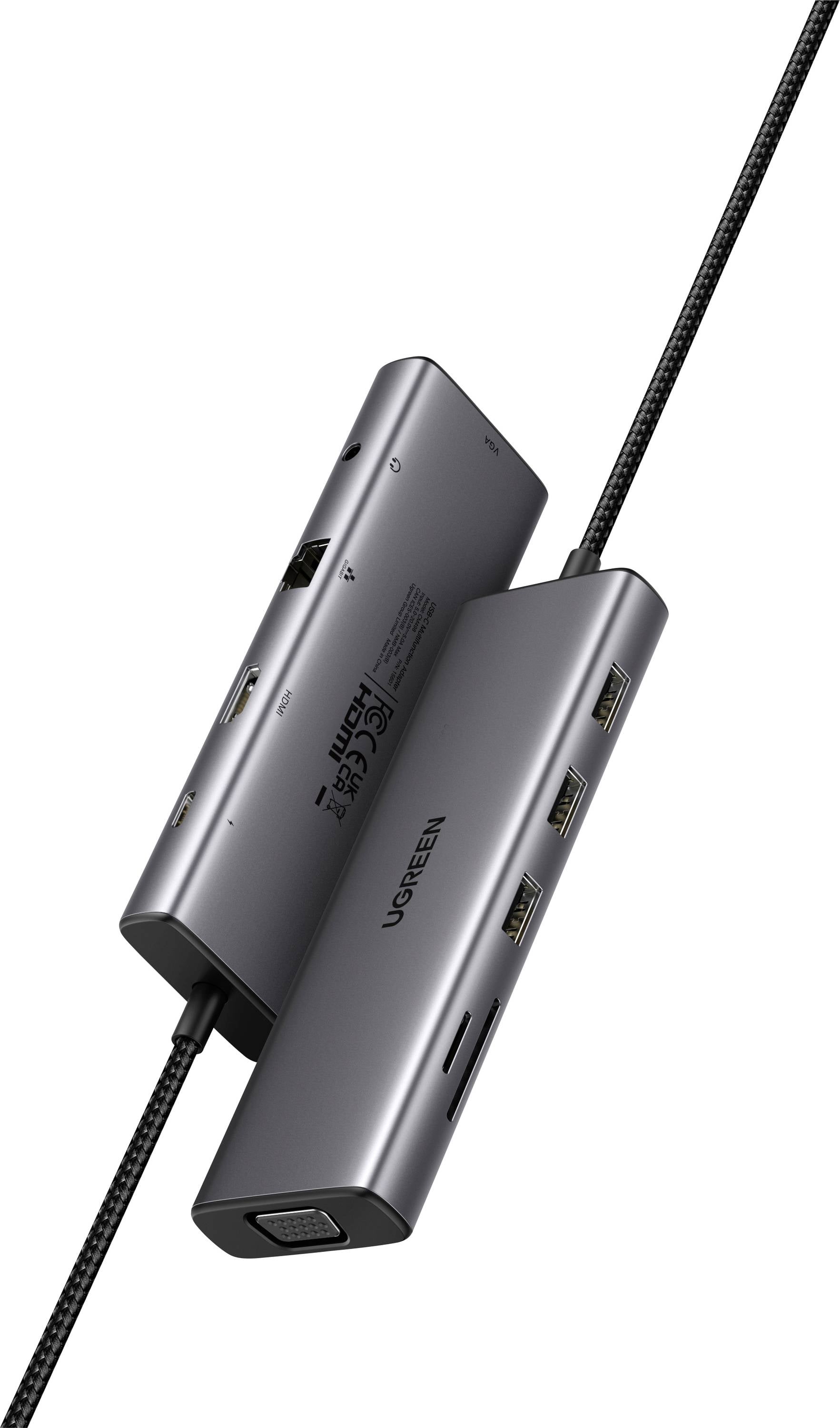 Ein zweiseitiger USB-C-Hub mit mehreren Anschlüssen, darunter HDMI, VGA, USB und Ethernet, aus einem Blickwinkel gezeigt. Er ist für Geräteverbindungen konzipiert.