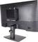 Ein kompakter schwarzer Computer, der über eine kleine Halterung an der Rückseite eines Monitors befestigt ist und eine platzsparende Desktop-Konfiguration präsentiert.