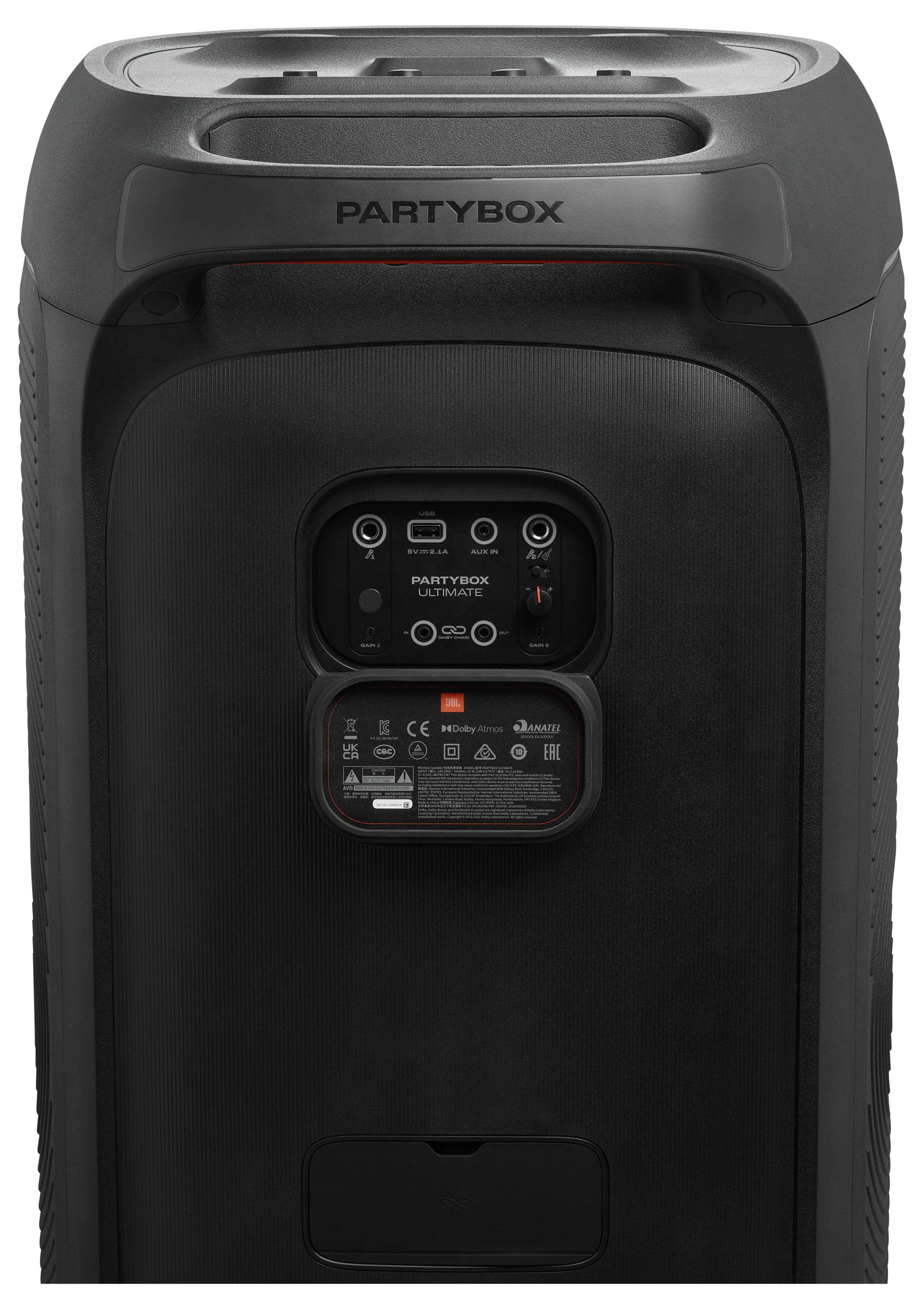 Ein großer schwarzer Party-Lautsprecher mit mehreren Eingangsbuchsen und Steuerungstasten, auf dessen Oberseite "PARTYBOX" beschriftet ist, speziell für Outdoor-Veranstaltungen konzipiert.